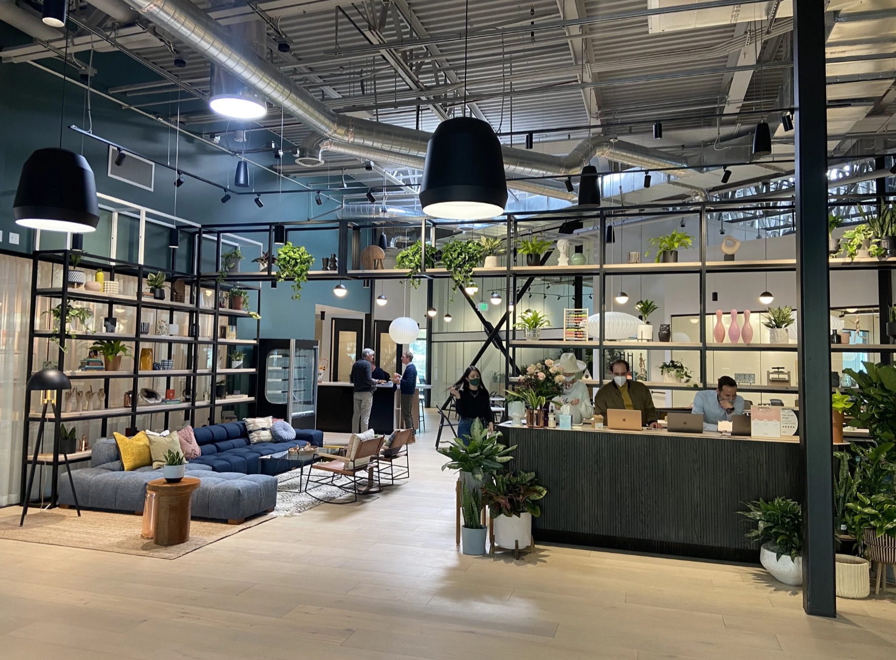 Finished Kiln coworking lobby with lounge seating and plants