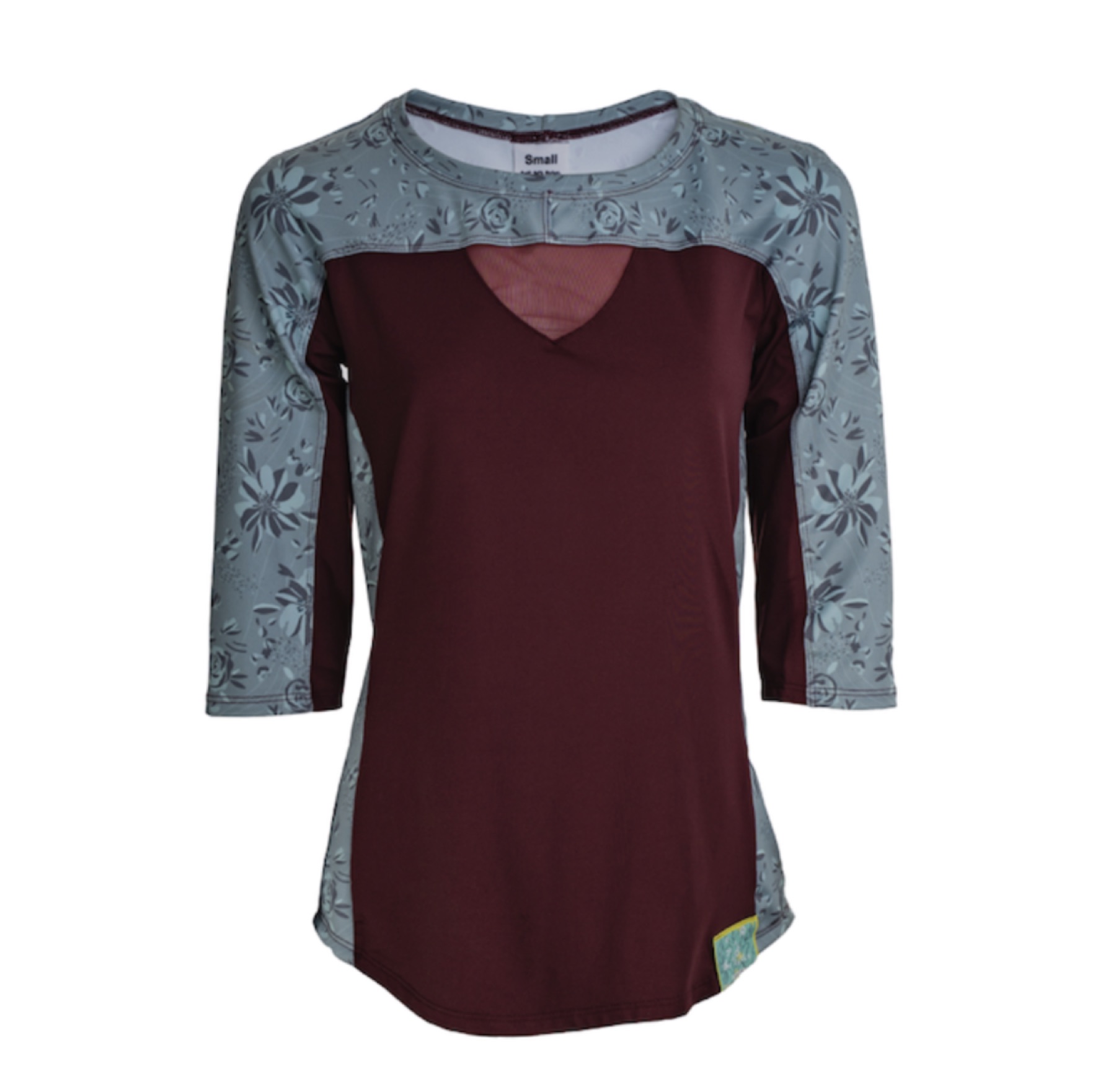 Burgundy Rock Roselle mountain bike top on a studio background